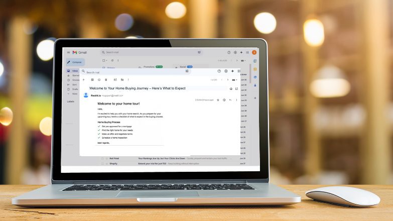 Laptop screen showing a real estate welcome email for home buyers, introducing a checklist and outlining what to expect during the home tour.