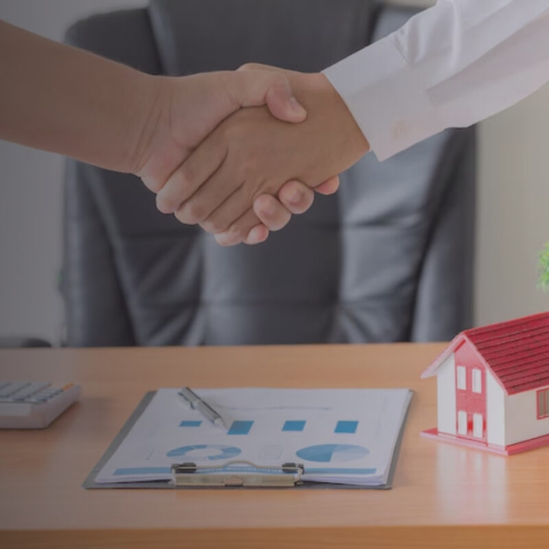 Successful real estate professional meeting wealthy clients at an exclusive luxury property.
