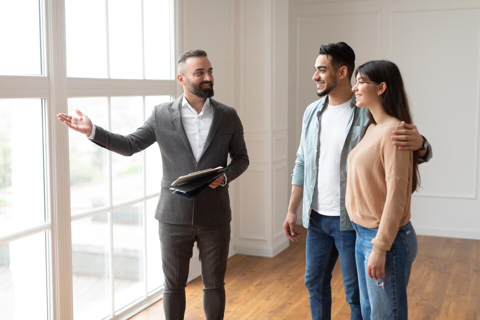 Realtor discussing home options with clients in a professional, client-focused consultation.
